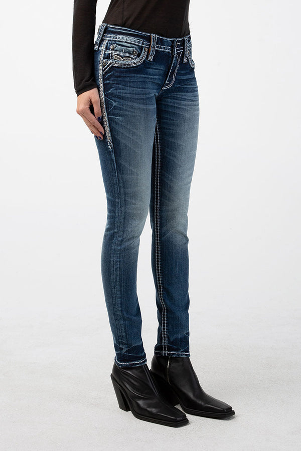 Skinny Damenjeans in mittlerem Blau mit dezenter Waschung und verzierten Taschen.
