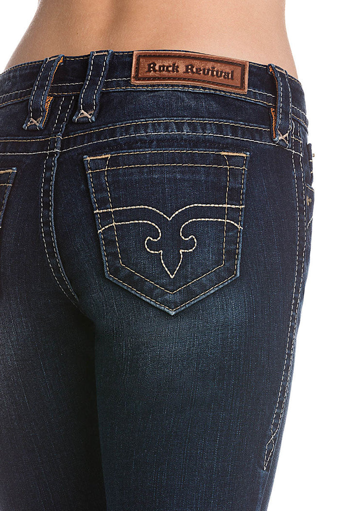 Dunkelblaue Skinny-Jeans für Damen mit heller Naht und Lederpatch am Bund.
