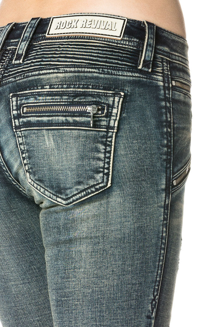 Dunkelblaue Skinny-Jeans mit Waschung und Ziernähten am Gesäßtaschenbereich.