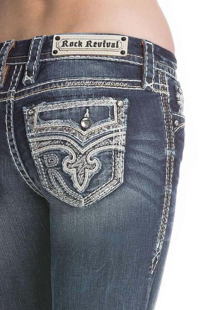 Dunkelblaue Skinny-Jeans mit hellen Nähten und verziertem Gesäßtaschen-Design.