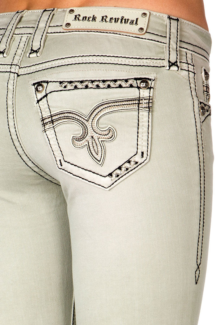Elfenbeinfarbene Skinny Jeans für Damen mit dekorativem Rückentaschen-Detail und sichtbaren Nähten.
